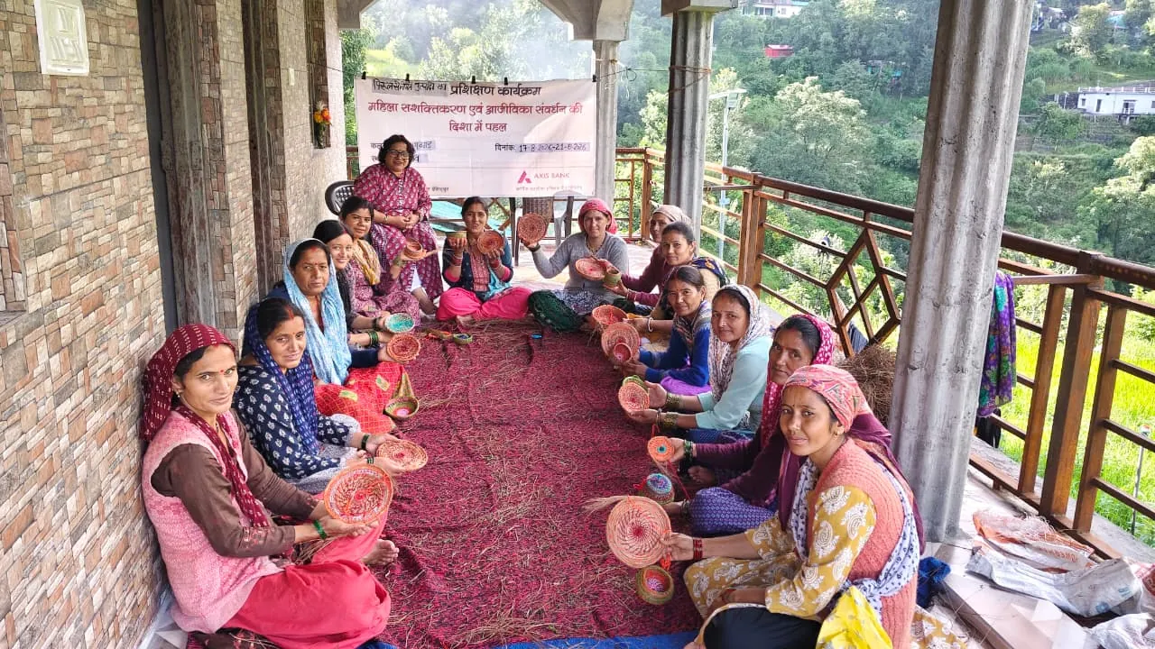 A women's self-help group meets on a veranda
