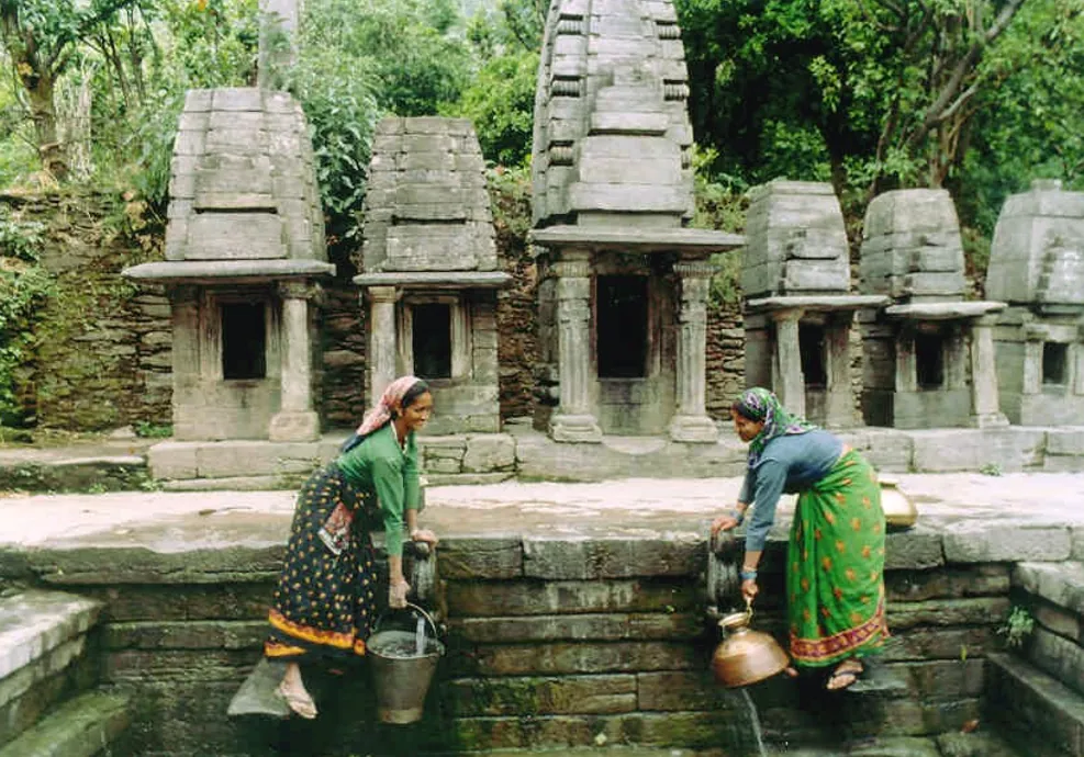 Women collect water at a traditional naula